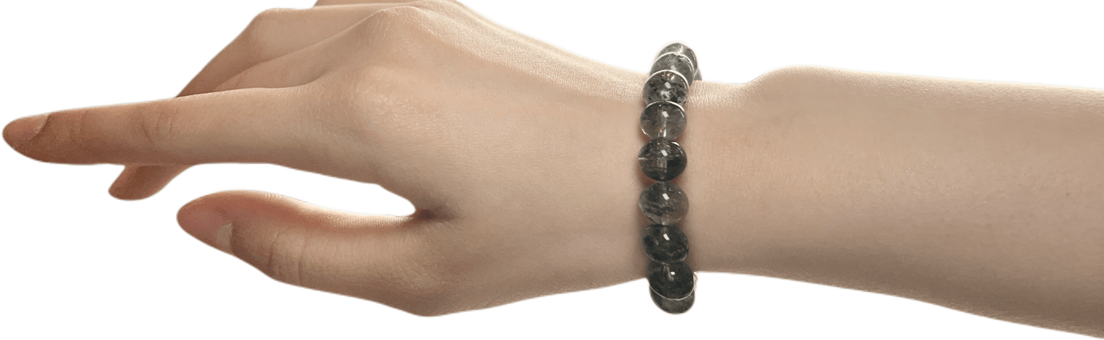 Green crystal bracelet worn on wrist