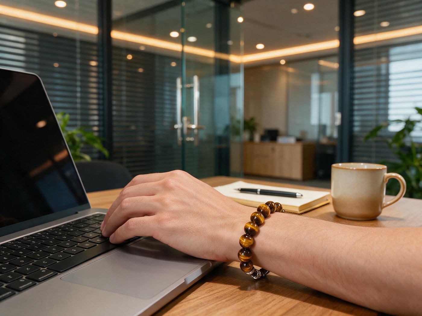 Tiger's eye bracelet worn at a desk